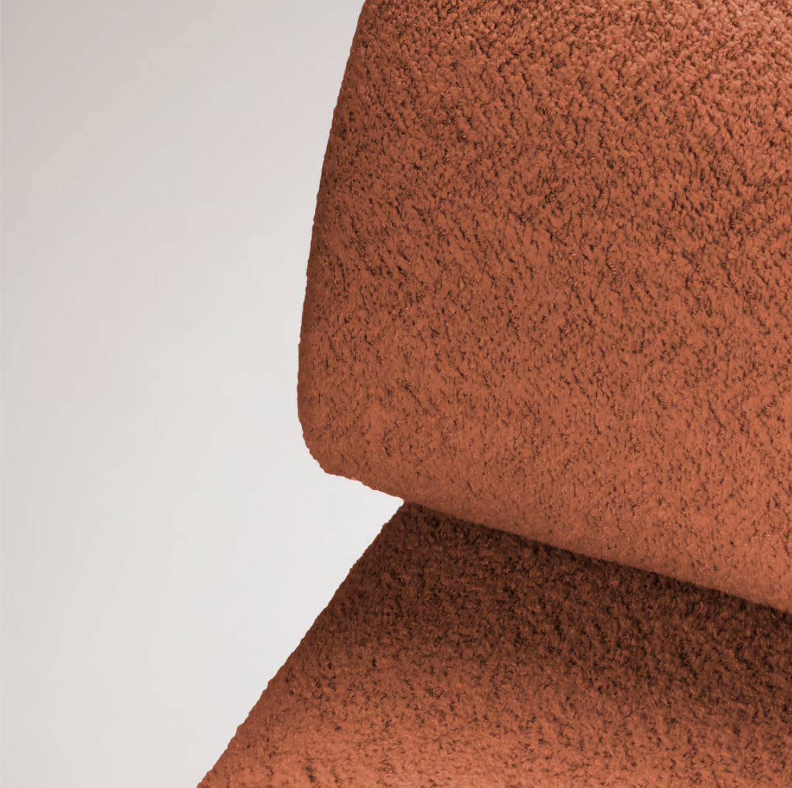Carmel Chair close-up of rust bouclé upholstery curve