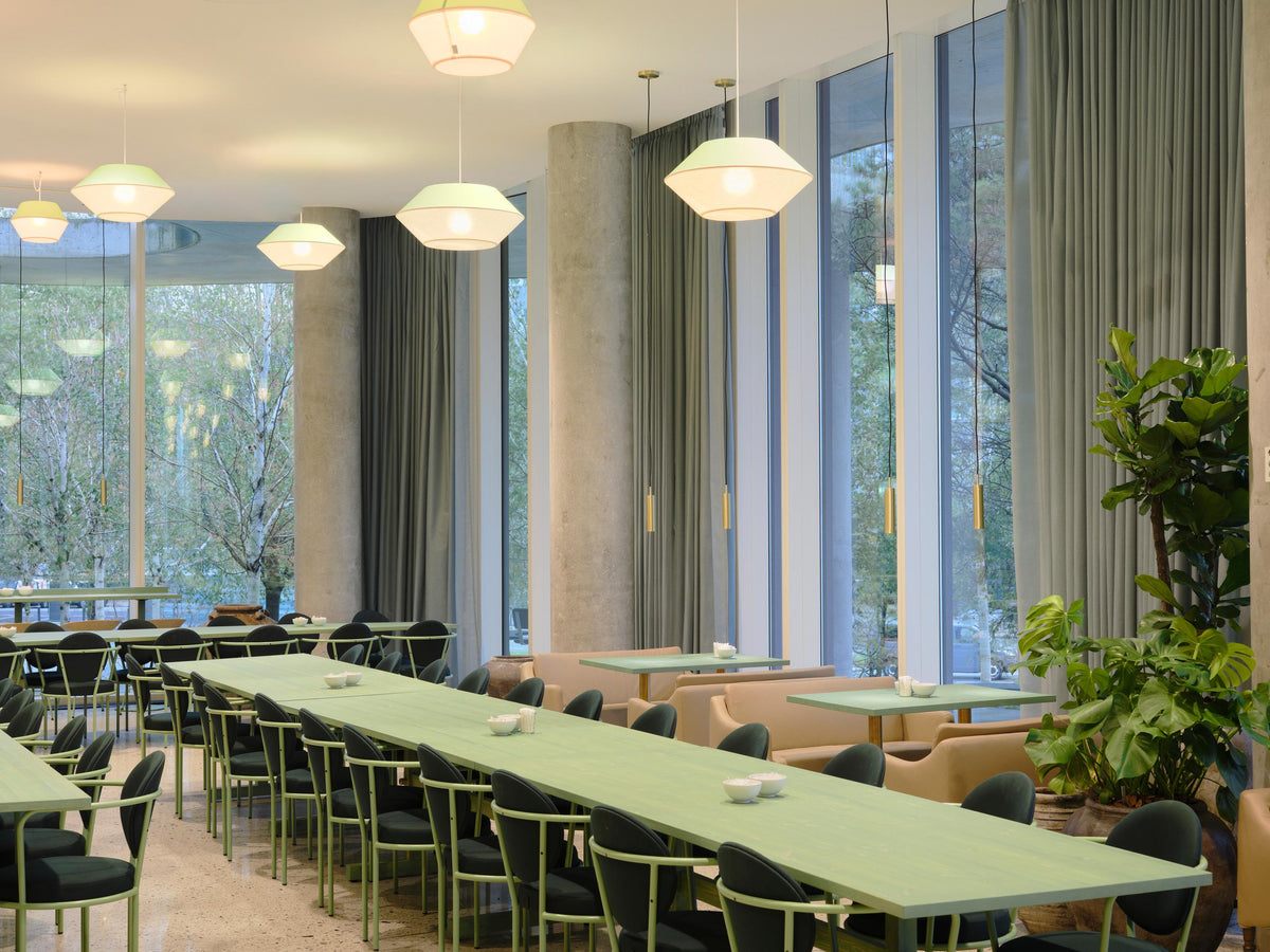 Casablanca Chairs along a long dining table by Maison Burgos