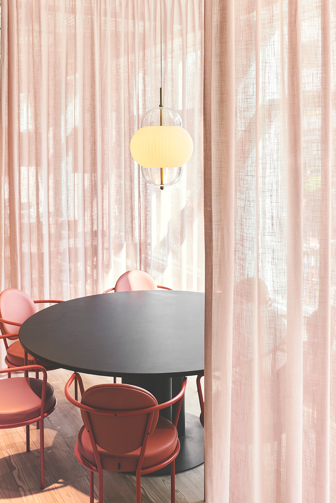 Casablanca Chairs around a round dining table by Maison Burgos
