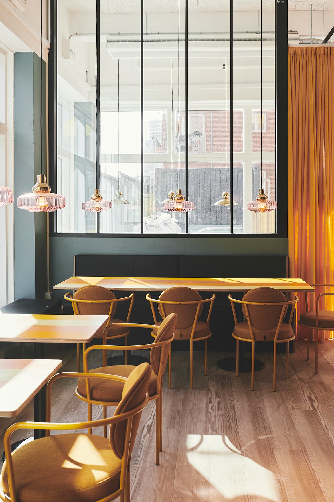Casablanca Chairs with orange frames in a cafe by Maison Burgos