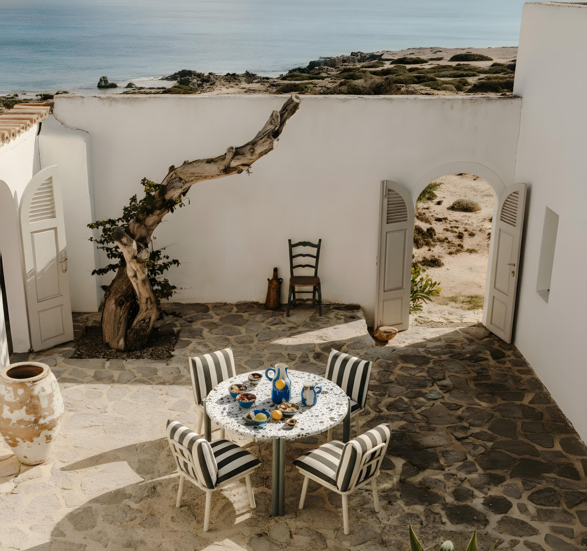 Duna Outdoor Dining Table courtyard lifestyle by Maison Burgos