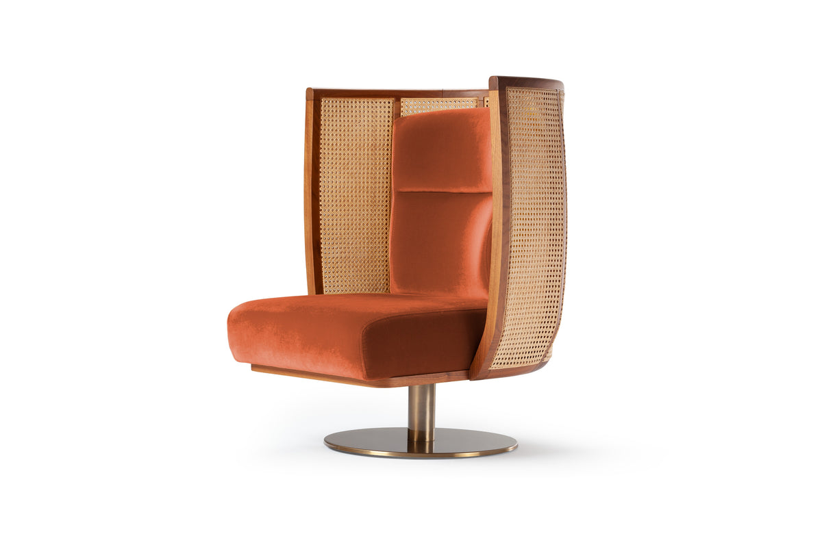 Egoista Armchair in burnt orange velvet with cane wings and swivel base, three-quarter view