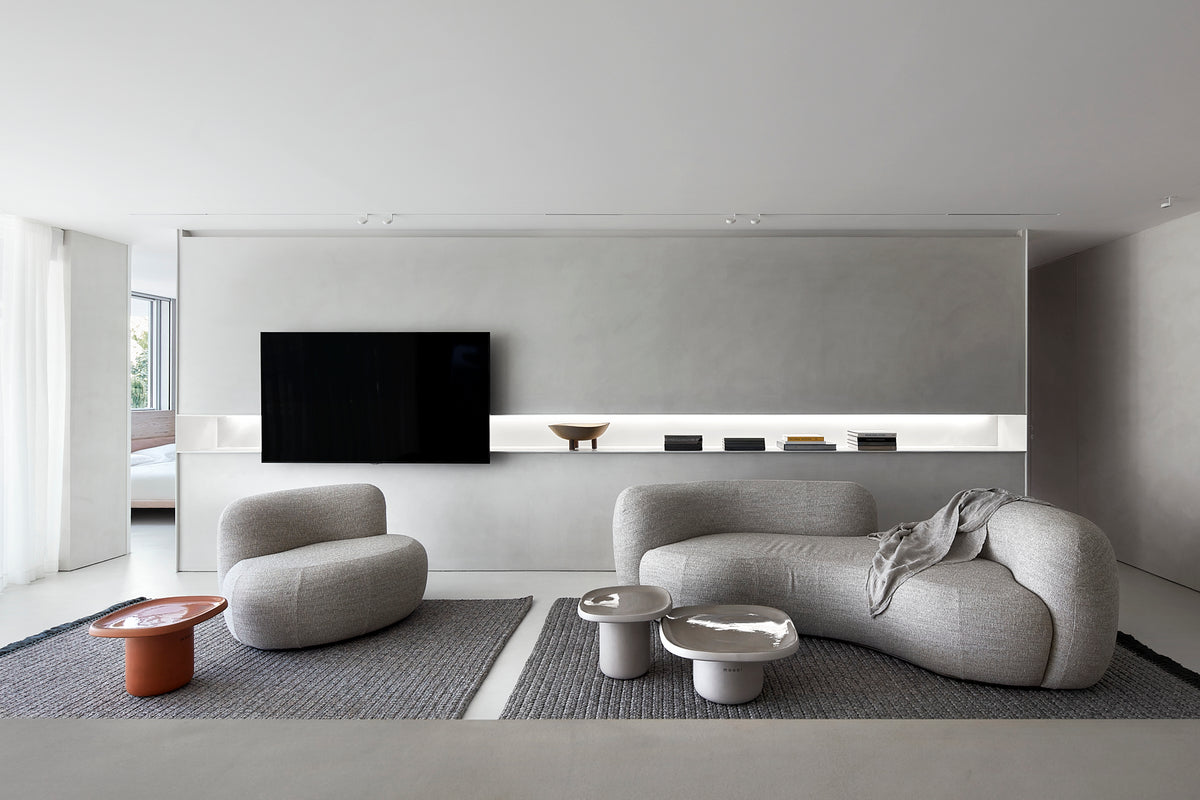 Tateyama Cloud Sofa pair in white bouclé in a grey living room with TV wall