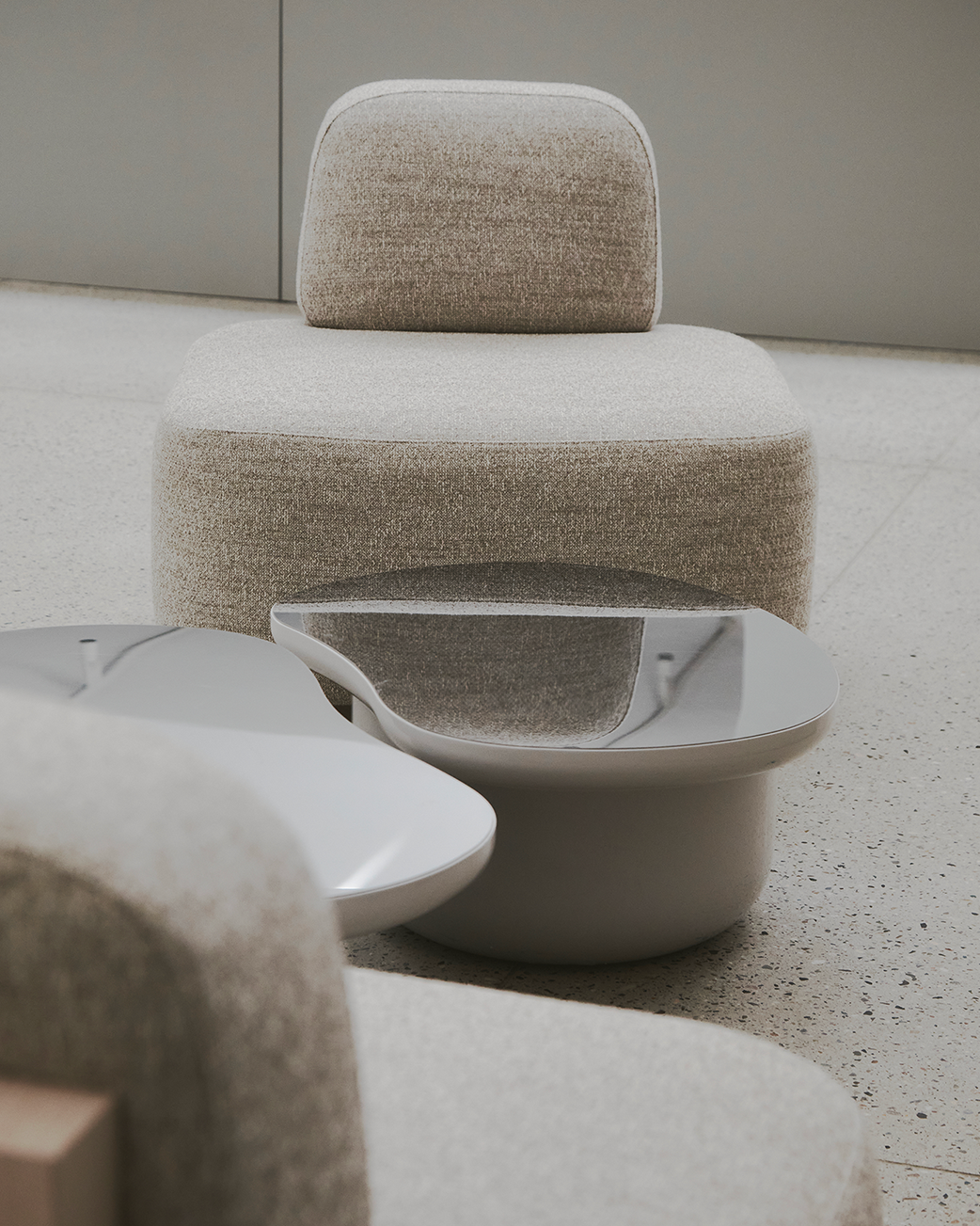Yoshida Lounge Chair in oatmeal weave, front view in a lounge with a low table