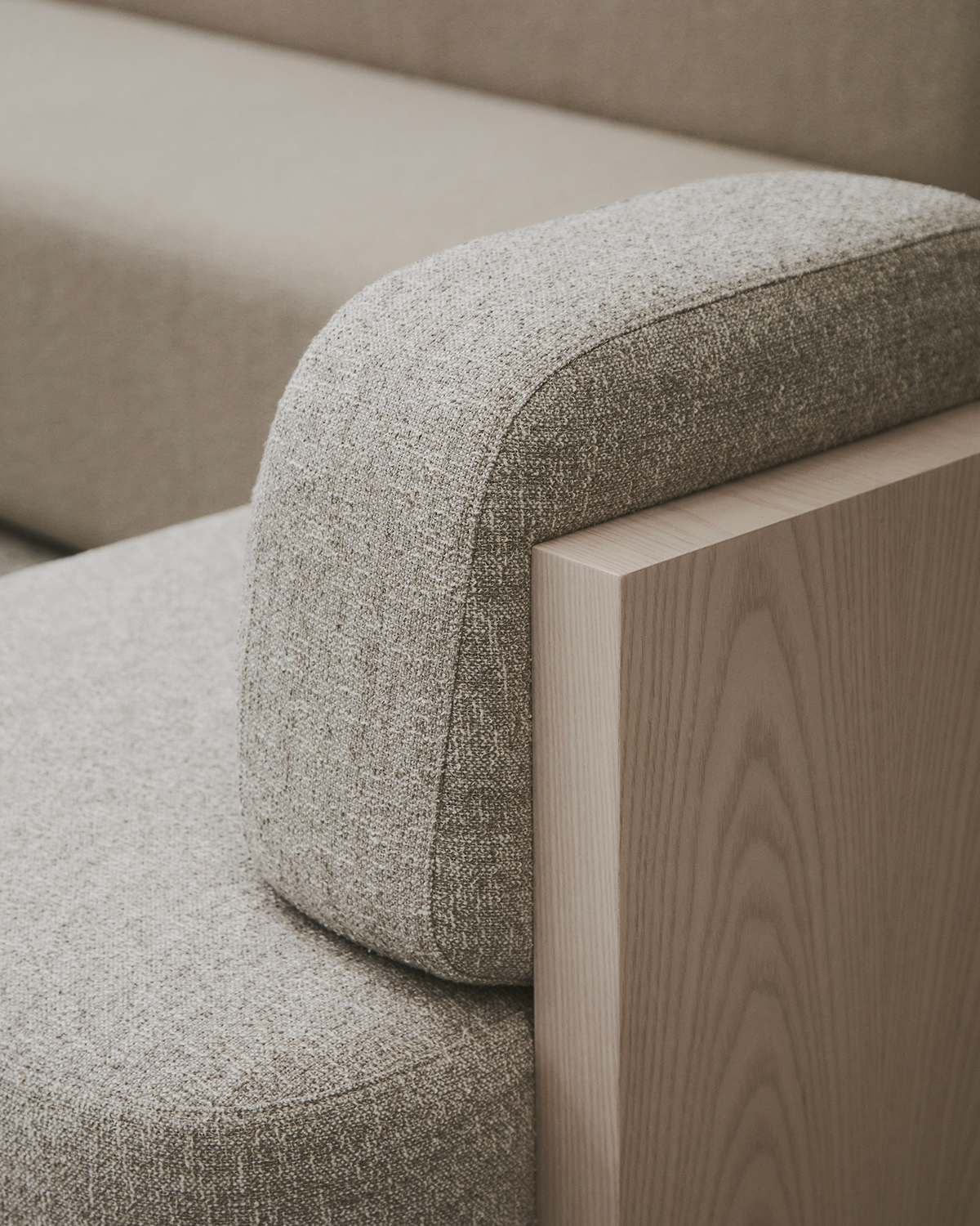 Yoshida Lounge Chair, close-up of the grey weave backrest meeting the oak side panel