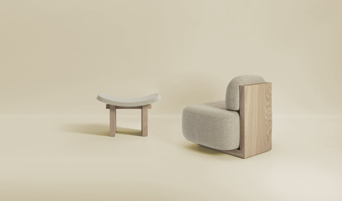 Yoshida Lounge Chair in cream with White Oak side panel beside a small wood stool