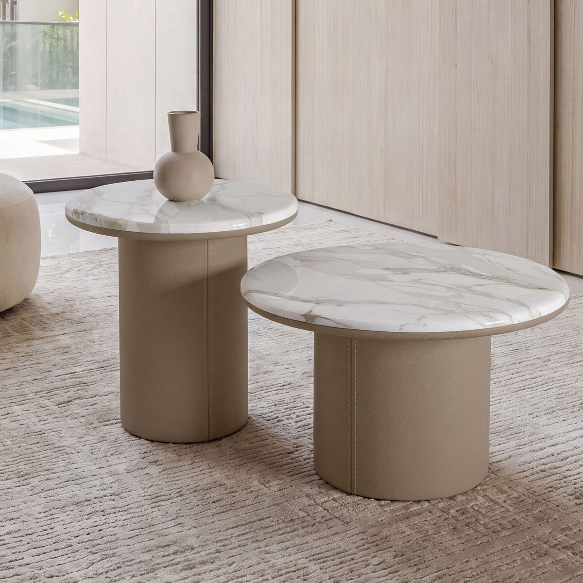 Gemini Round Side Tables with beige bases and a vase, close view