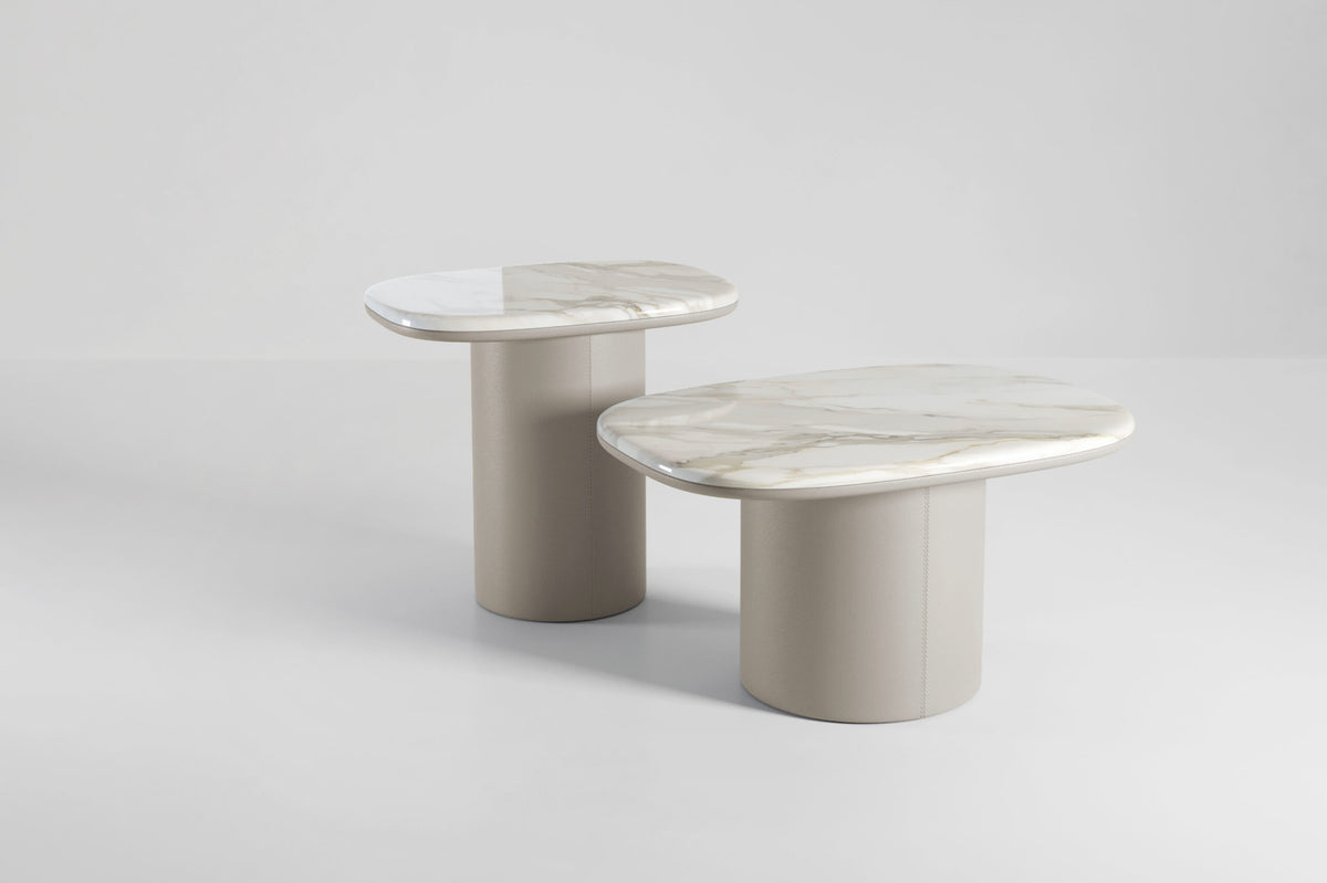 Gemini Soft Hex Side Tables pair in white marble with taupe bases on grey
