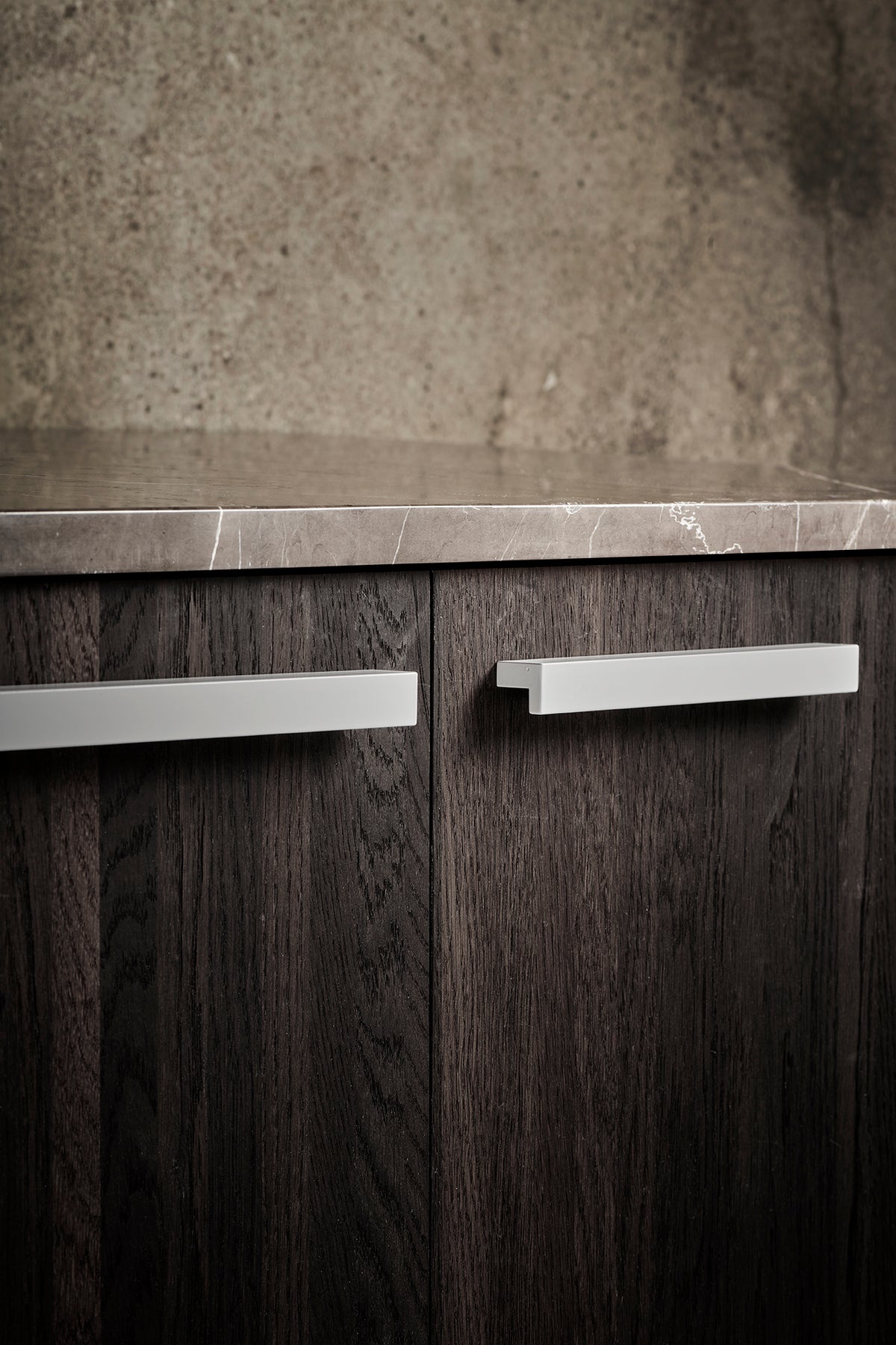 Get a Grip 2 cabinet handles in white on a walnut cabinet by Maison Burgos