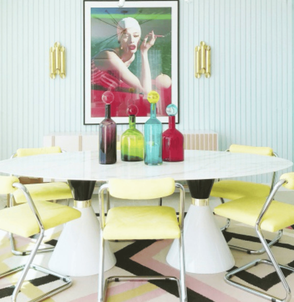 Go Sideboard in a colourful dining room with yellow chairs and pink artwork