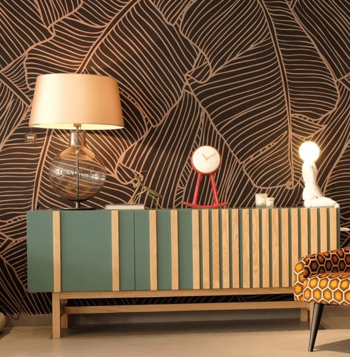 Go Sideboard in Jade against bold leaf wallpaper with a table lamp
