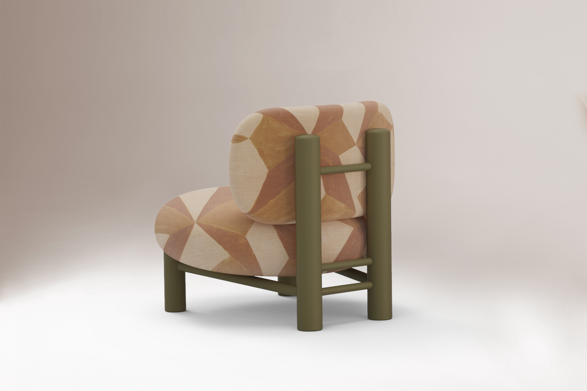 Aimi Lounge Chair in peach geometric fabric, back three-quarter view of the olive frame