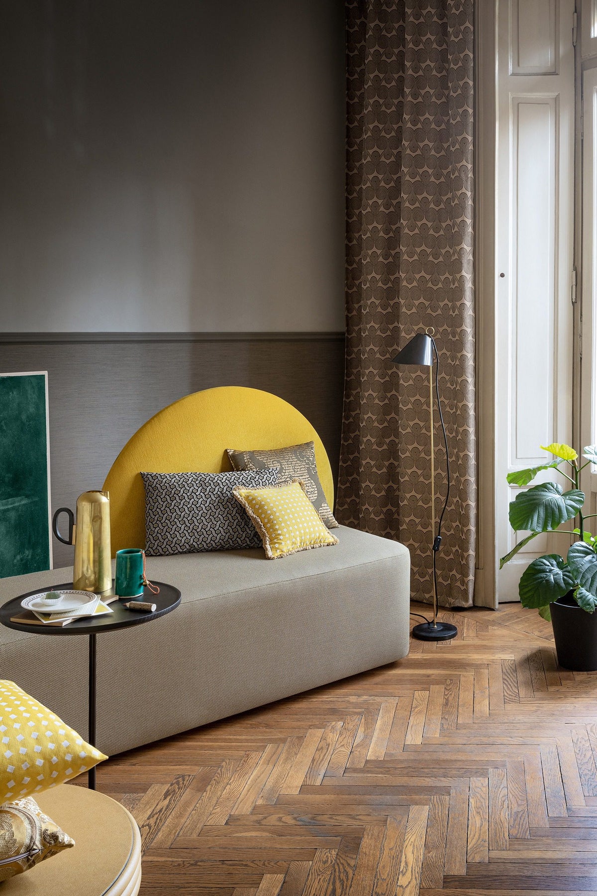 Horizon Sofa with mustard disc backrest in a room with herringbone floors