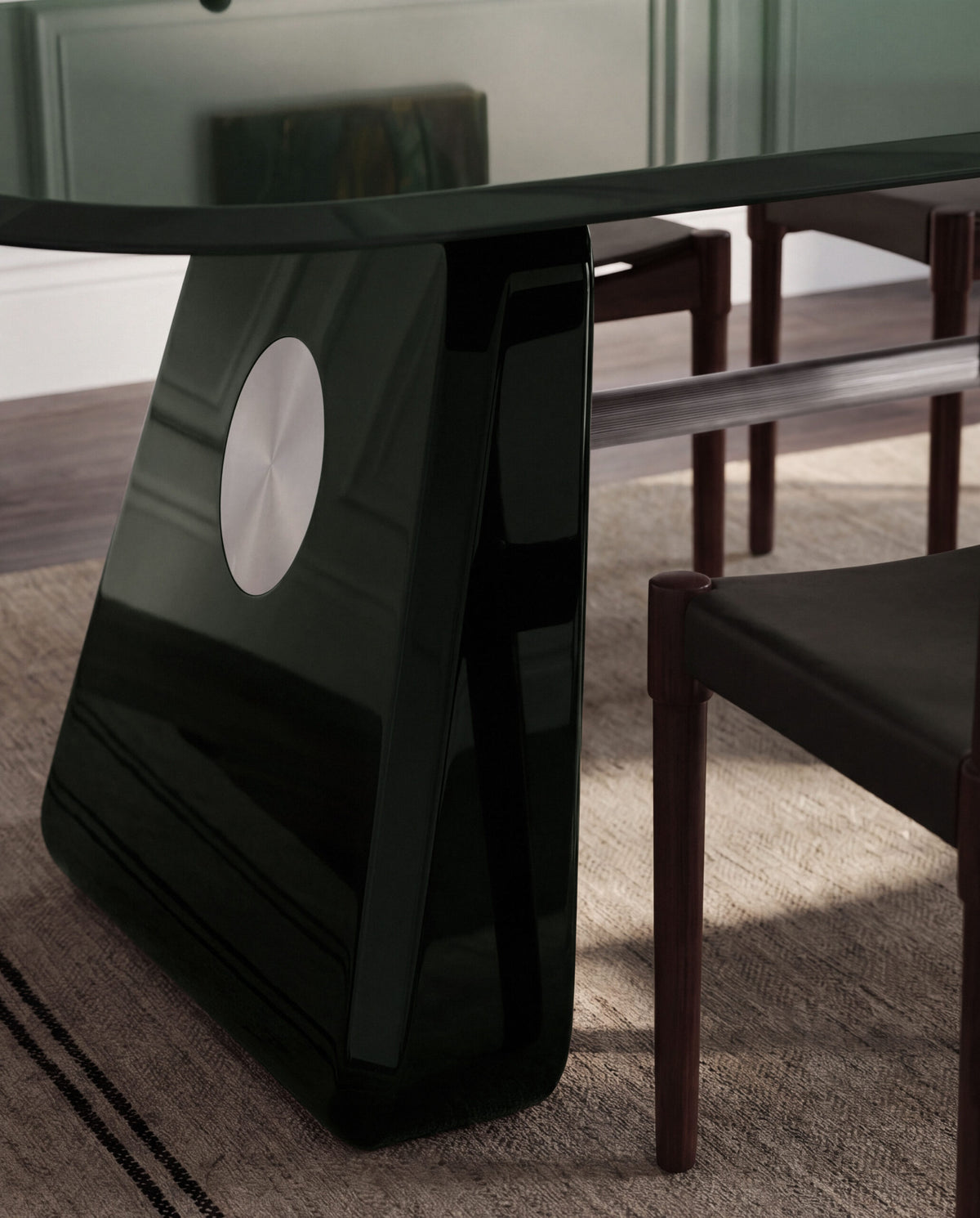 Inge Dining Table in green lacquer with dark wood chairs, leg detail