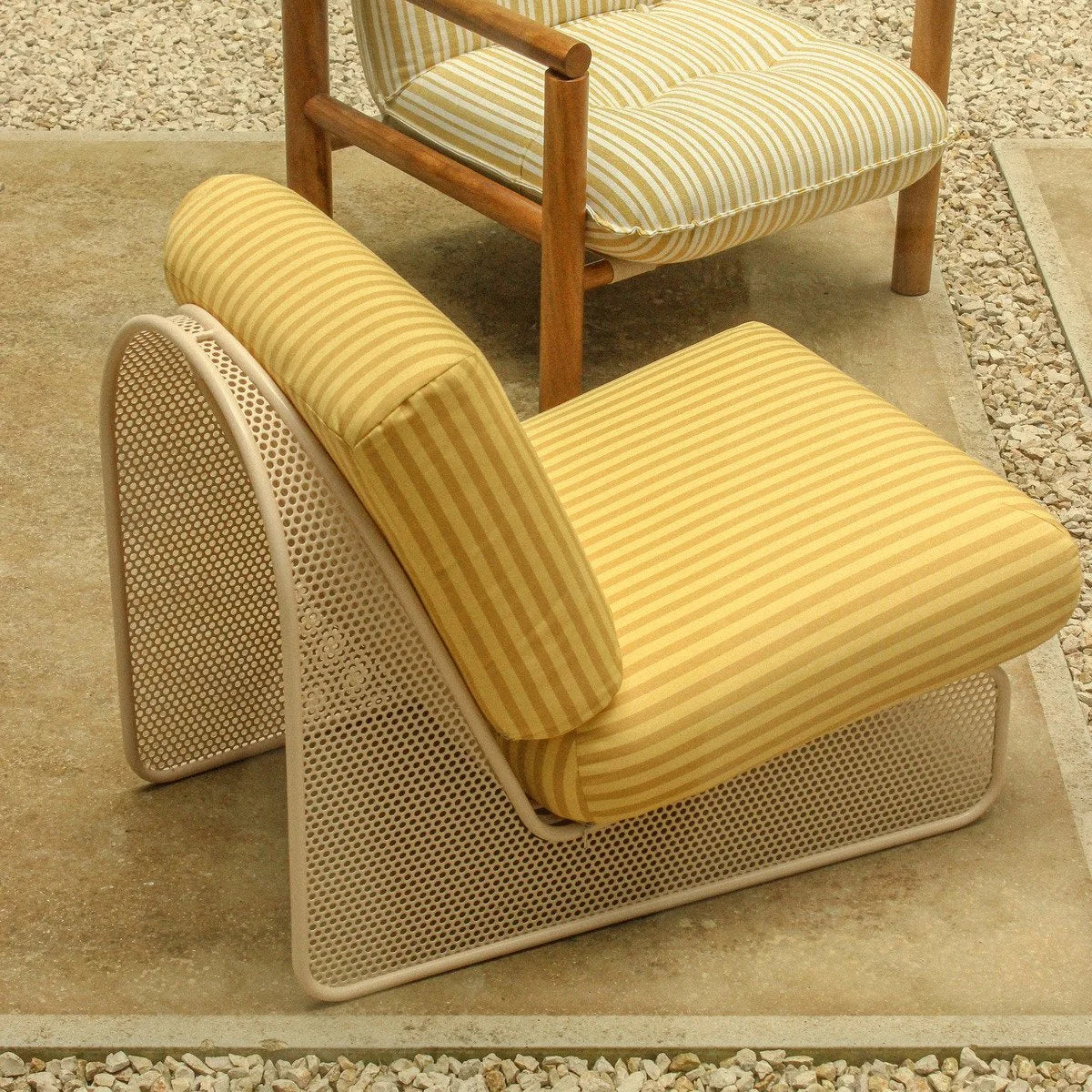 Riviera Armchair in yellow stripe, close view of curved perforated metal frame
