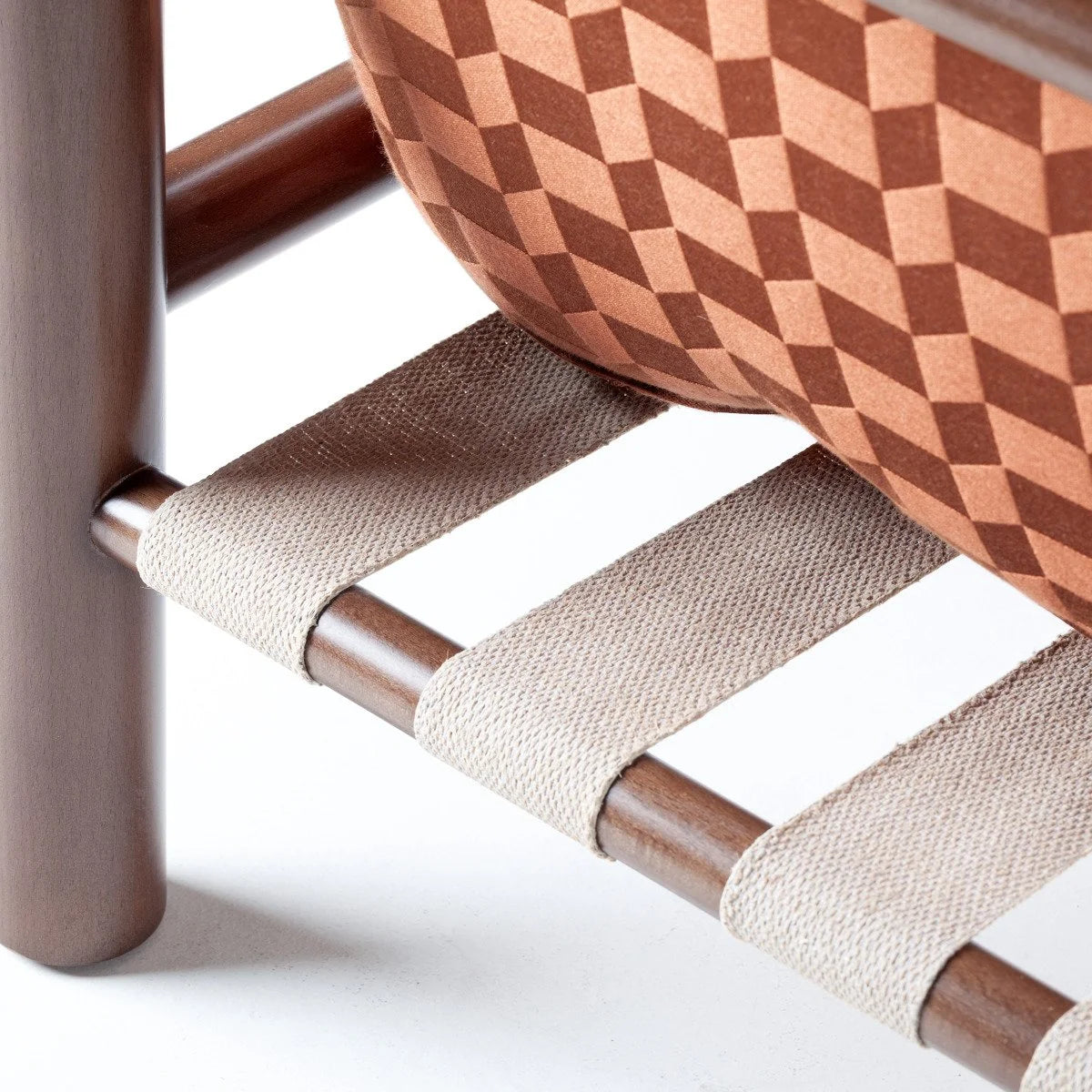 James Armchair - Outdoor, close-up of the webbing support under a geometric fabric cushion