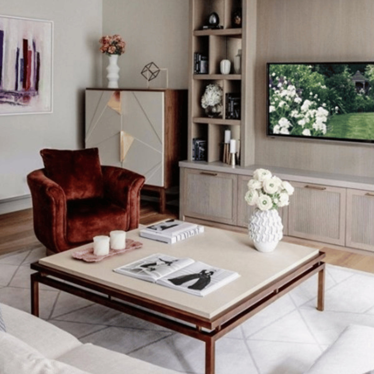 Jazz Bar Cabinet in a living room beside a rust velvet armchair and TV wall