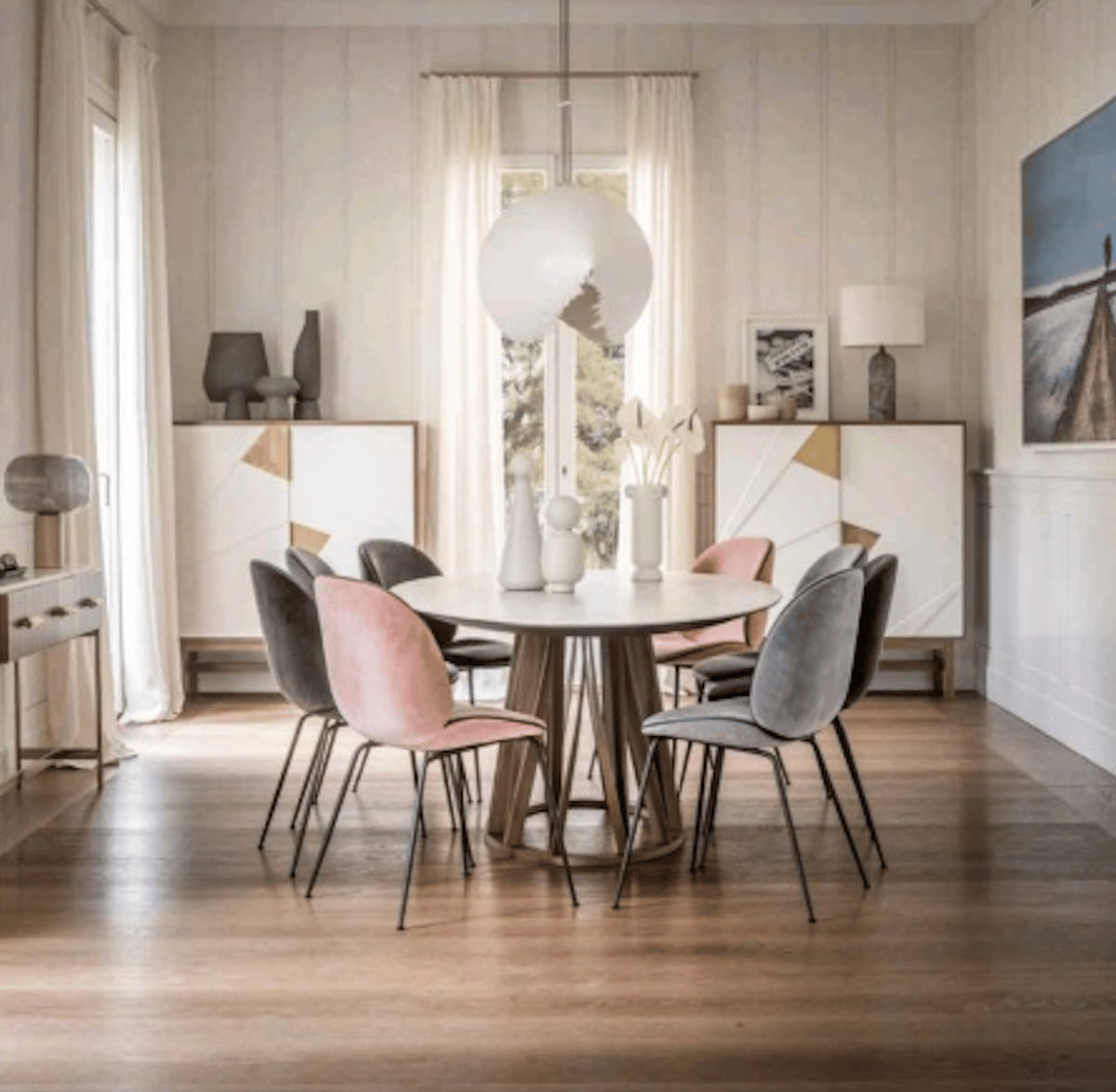 Jazz Bar Cabinet pair flanking a dining area with a round table
