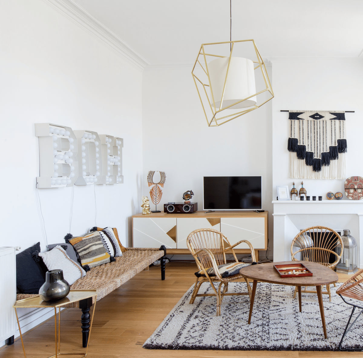 Jazz Sideboard with ivory doors in a bright living room with rattan chairs