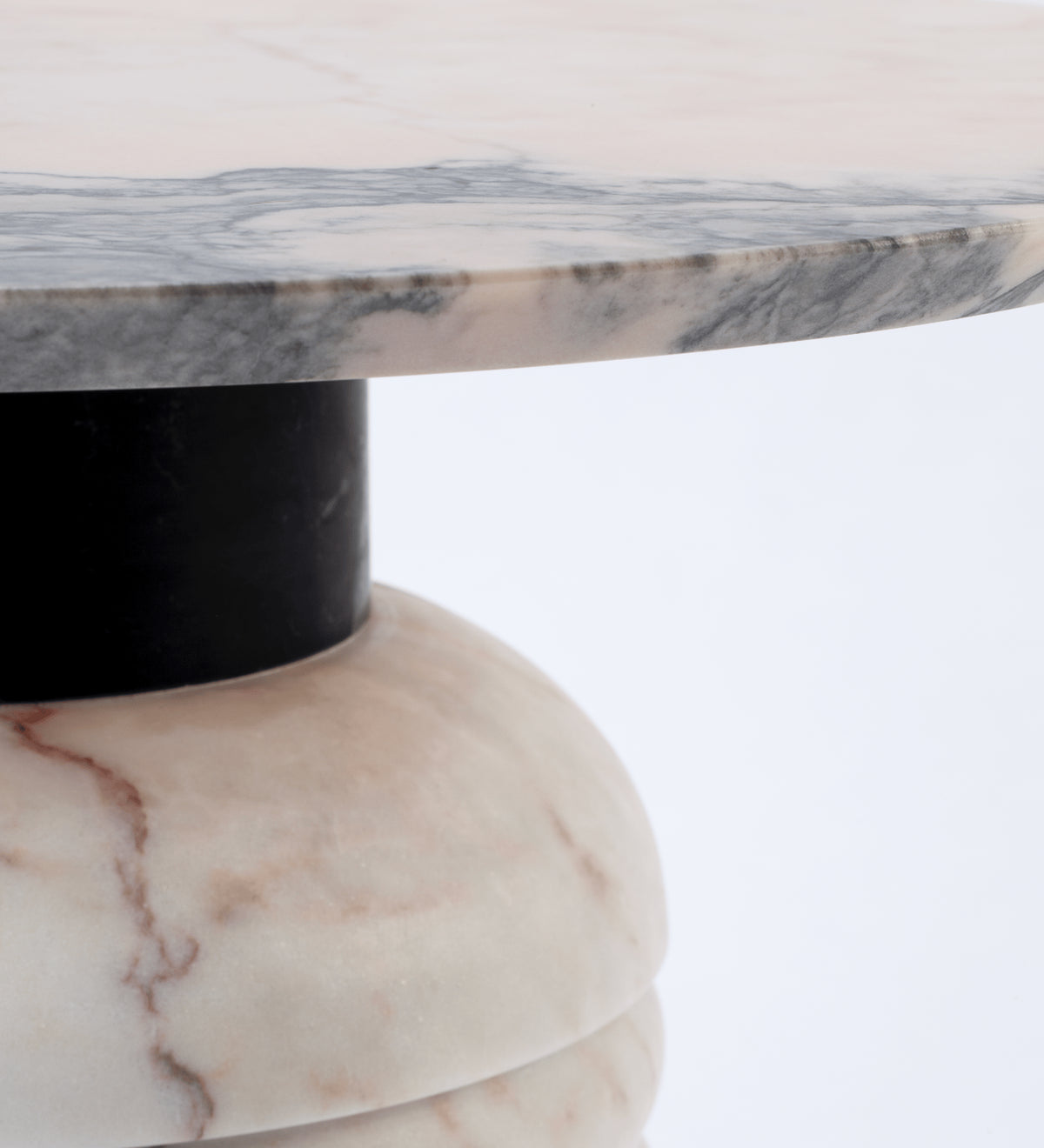 Jean Side Table close-up of veined marble top edge over a black middle part