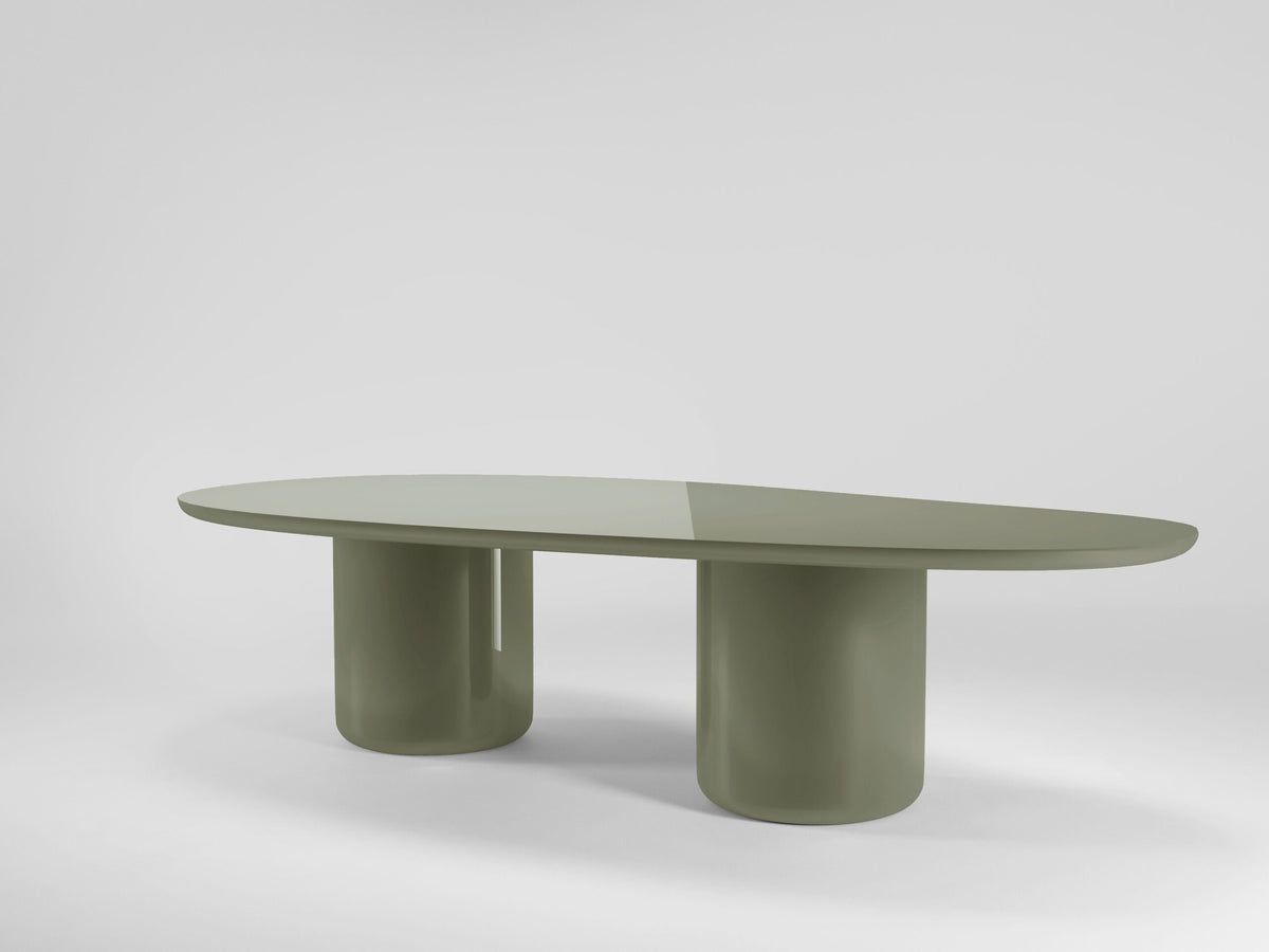 Laghi II Dining Table in sage green lacquer on a grey backdrop
