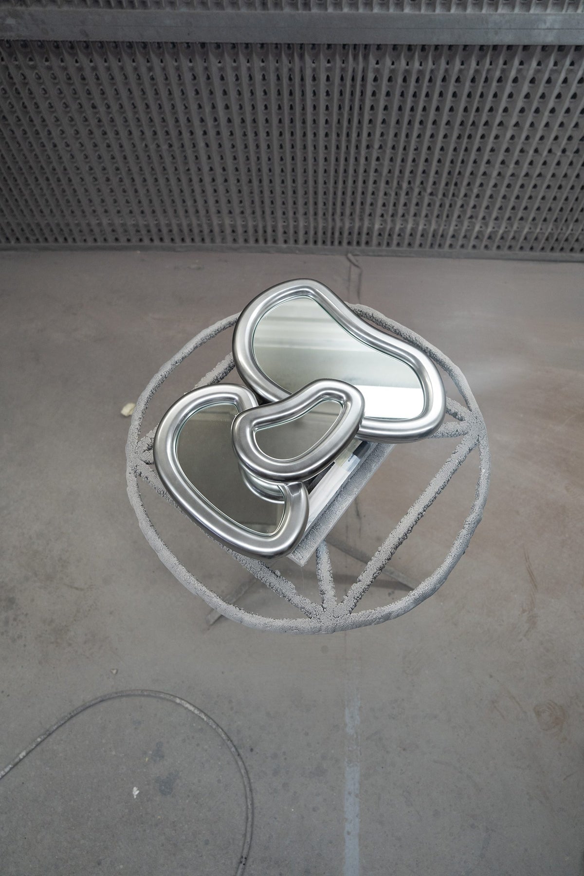 Laghi Mirrors silver mirrors stacked on a workshop floor