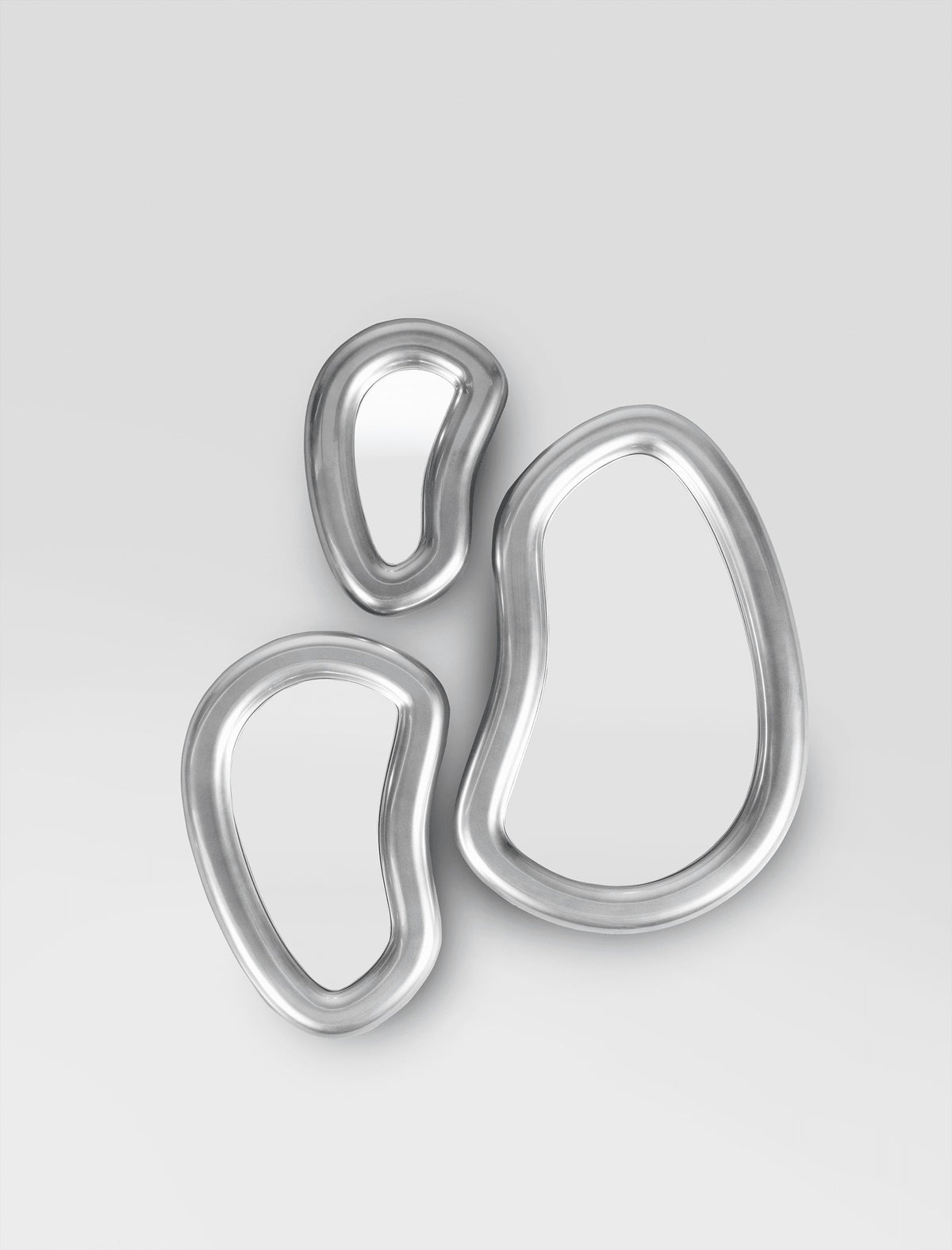 Laghi Mirrors trio in polished silver on a light grey wall