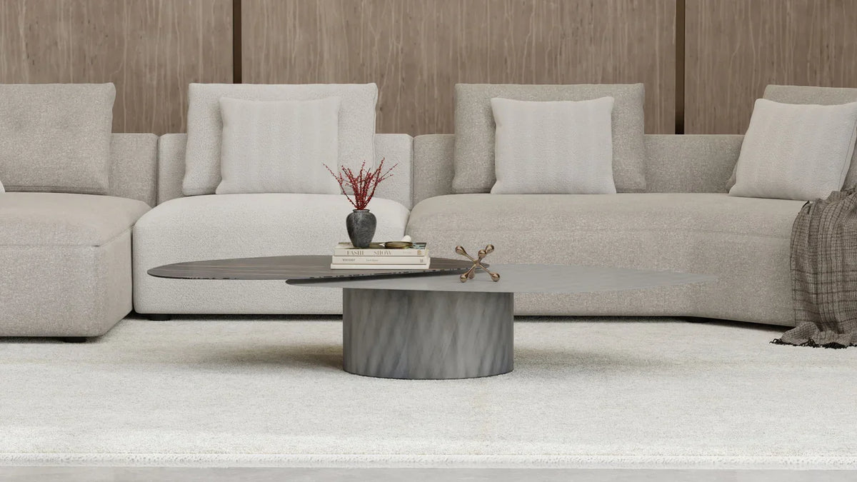 Layer Coffee Table in front of a grey sectional sofa, close view