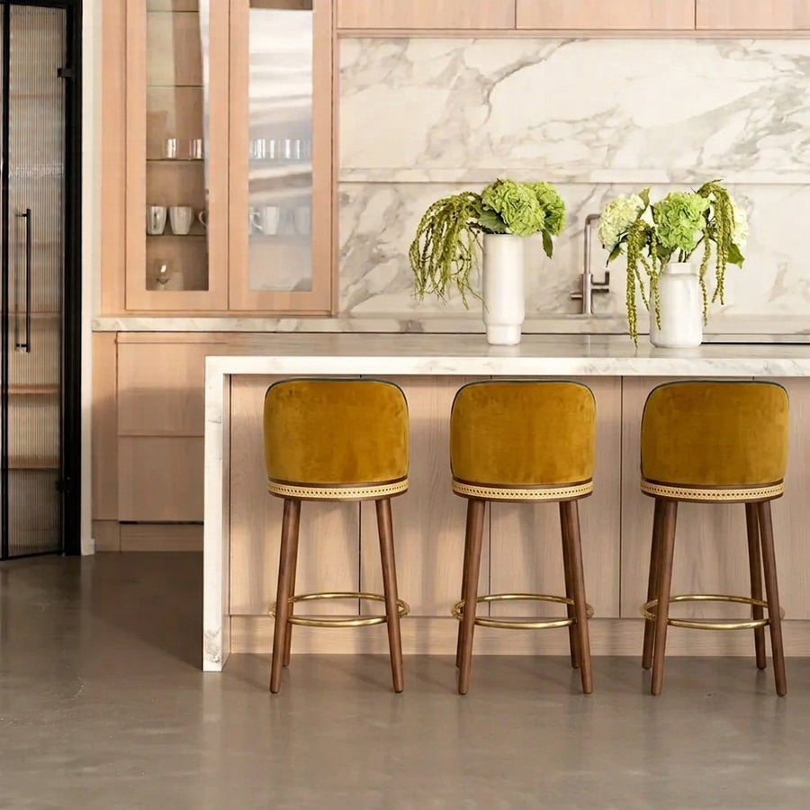 Alma counter stools in a marble kitchen by Maison Burgos