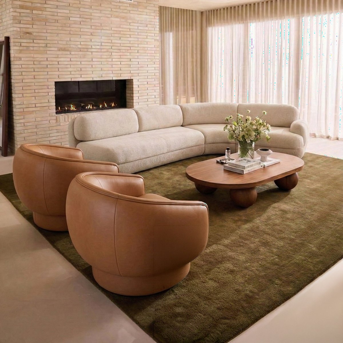 Living room with leather lounge chairs by Maison Burgos