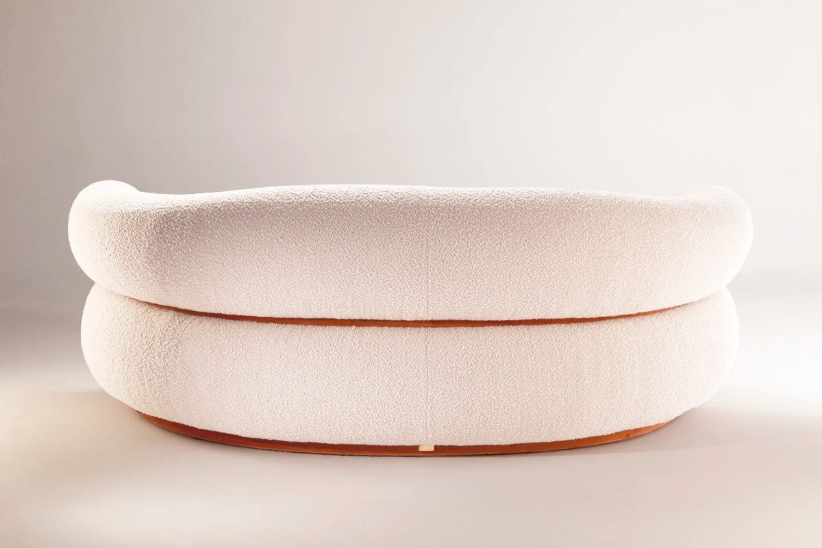 Malibu Curved Sofa in cream bouclé, back view showing rolled backrest