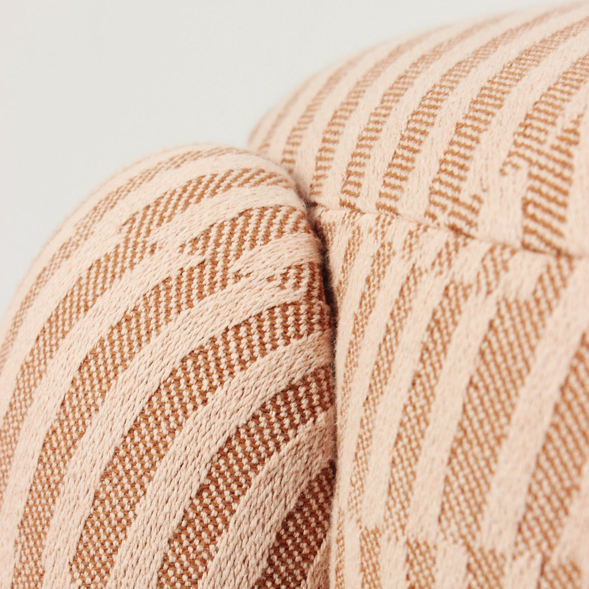 Marlon Pouf close-up of the pink and rust striped weave