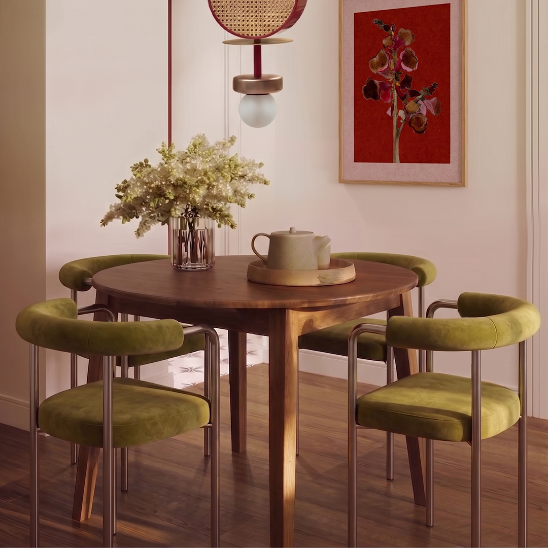 Volta Dining Chair set in olive velvet around a round wood table with flowers
