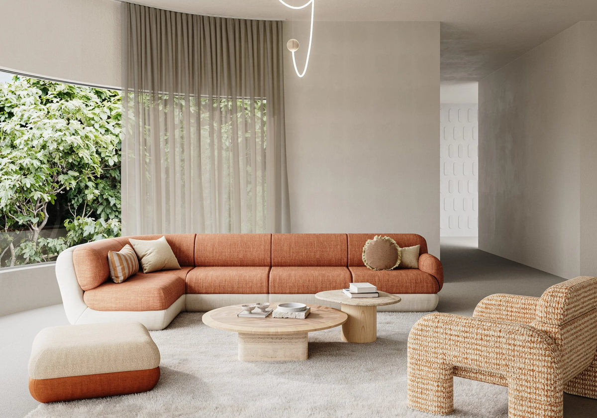 Mood Sectional Curved Sofa in rust in a bright living room