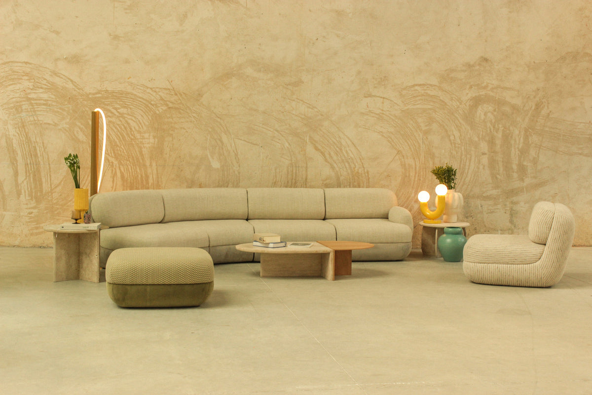 Mood sectional seating with pouf in an interior setting by Maison Burgos