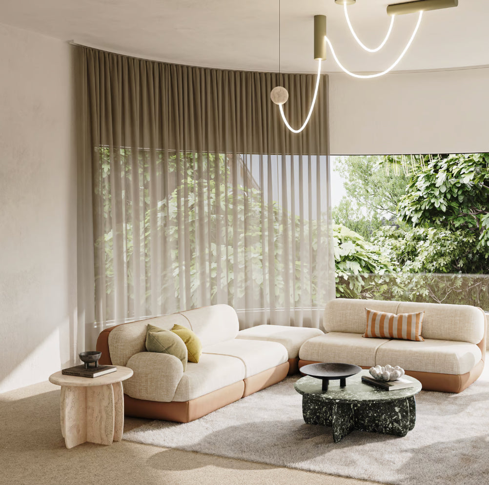 Mood Sofa - 2 Seater in cream with striped cushions in a garden-view living room