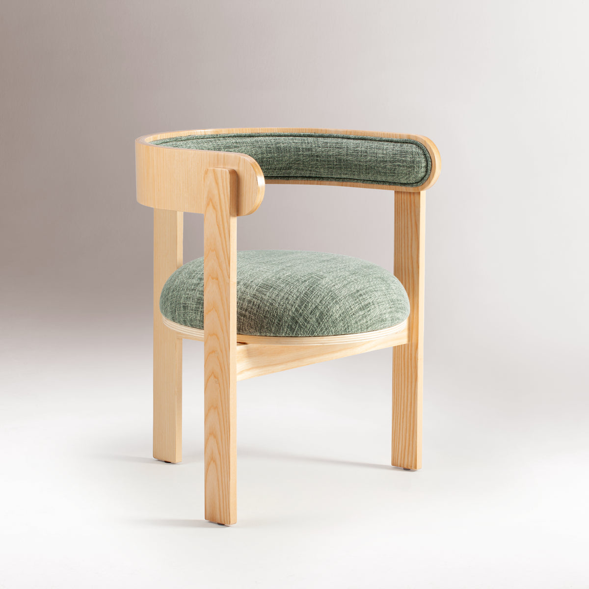 Moulin Dining Chair in natural beech with green upholstery, three-quarter view on grey