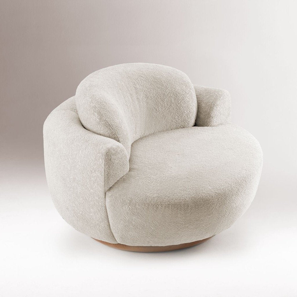 Naked Armchair in ivory Bouclé against a soft grey backdrop