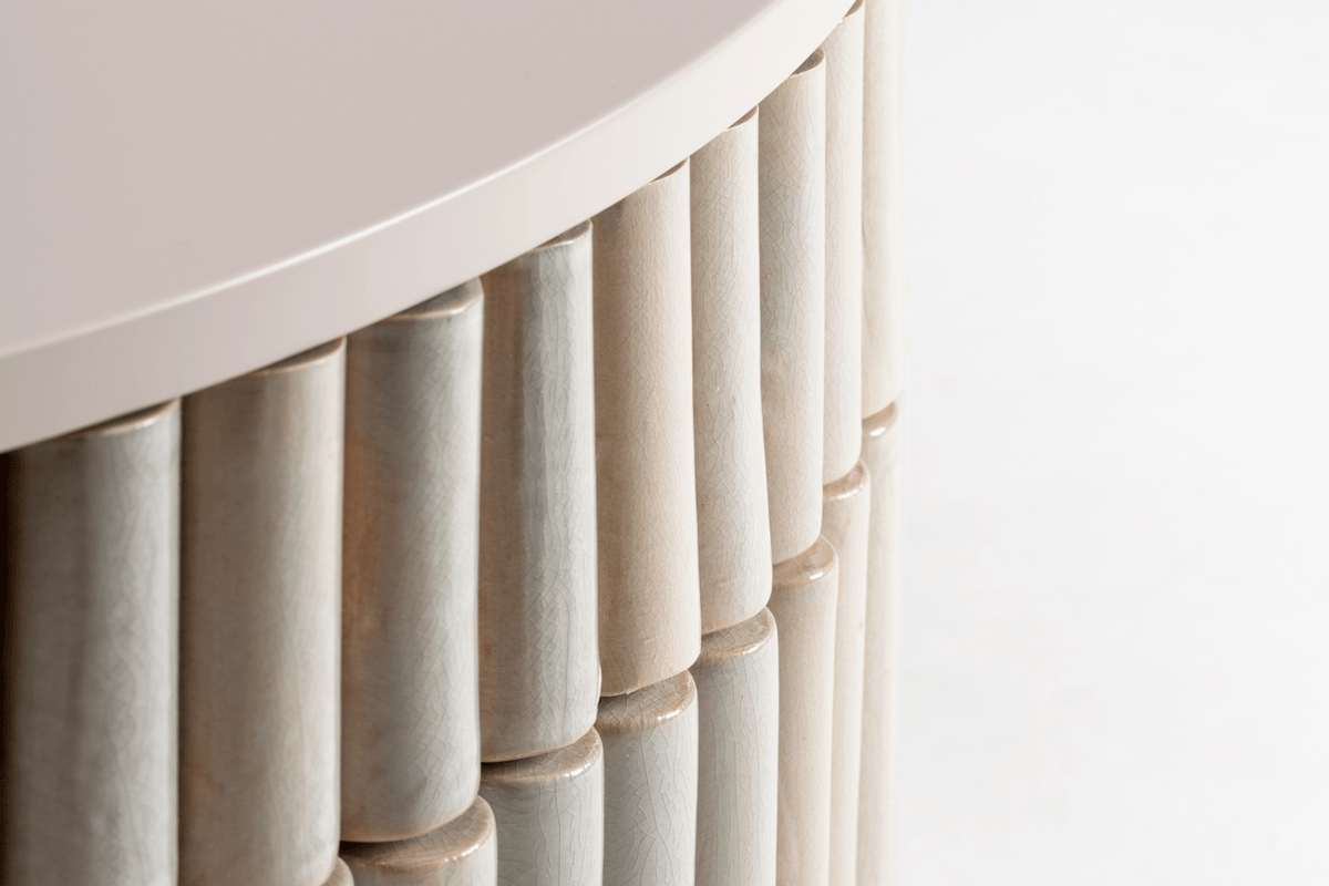 Nouvelle Vague Center Table close-up of glazed tile ribs under the top
