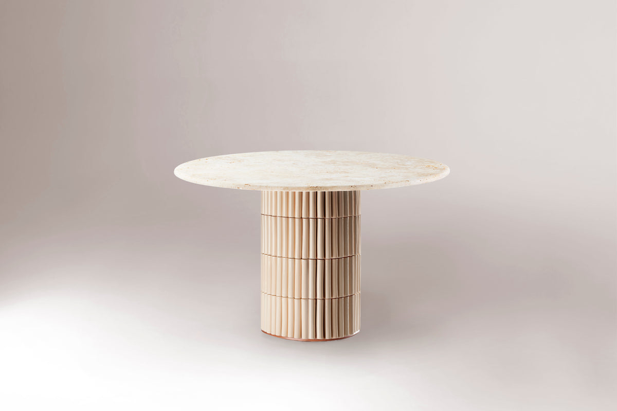 Nouvelle Vague Dining Table with Nude tiles and Travertine top on a studio backdrop