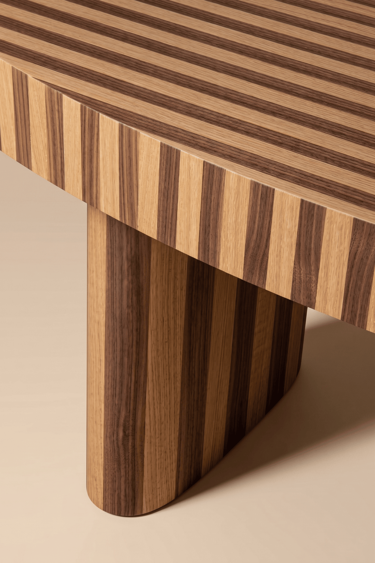 Nusa Dining Table close-up of the striped wood top and leg