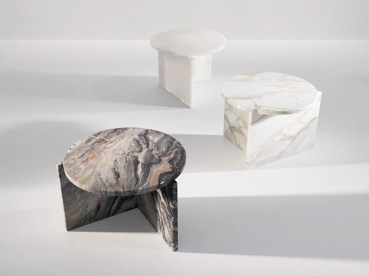 Origin Side Table trio in dark and white marbles casting soft shadows