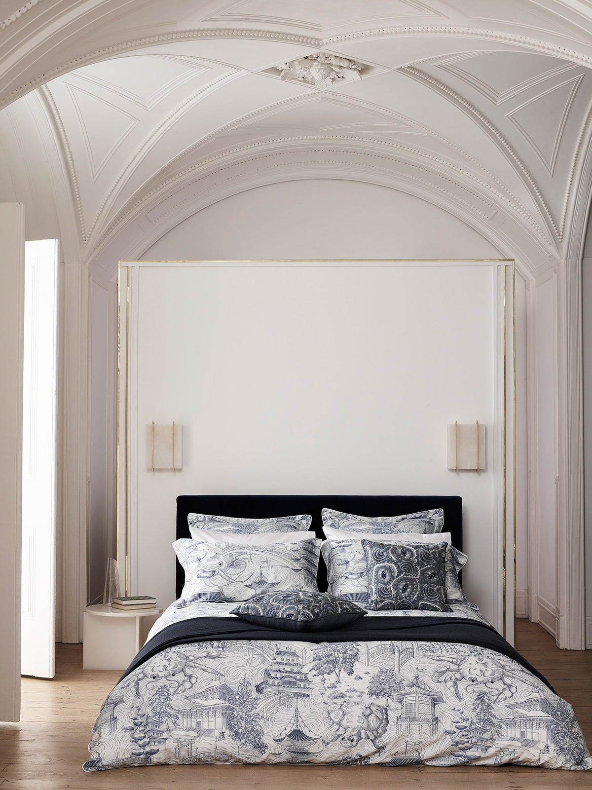 Origin Side Table pair flanking a bed in a vaulted bedroom