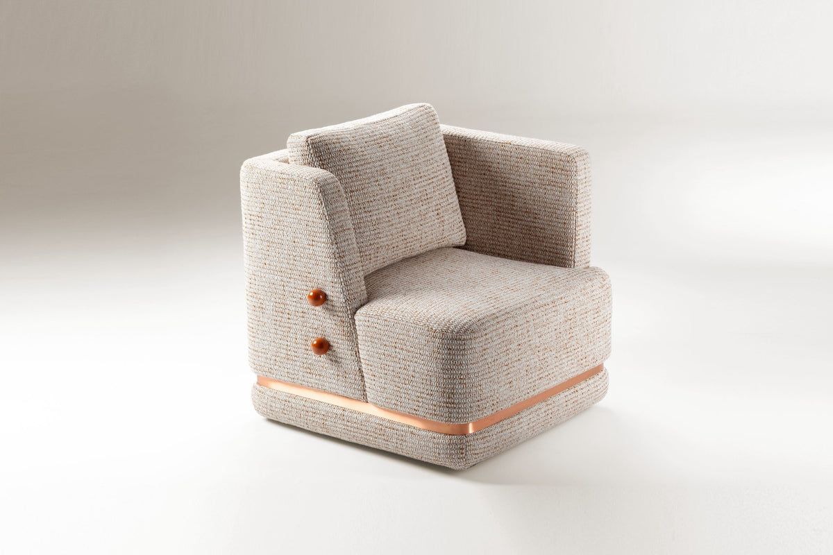 Panorama Armchair in oatmeal bouclé with copper base band, three-quarter view