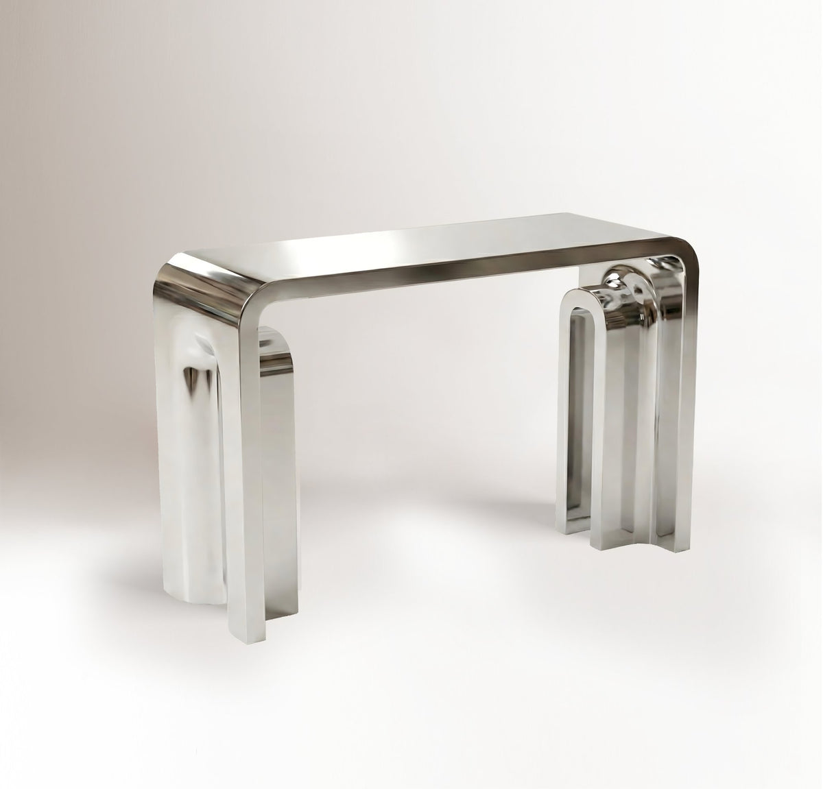 Plié Console in Polished Inox, three-quarter view of the folded stainless steel form