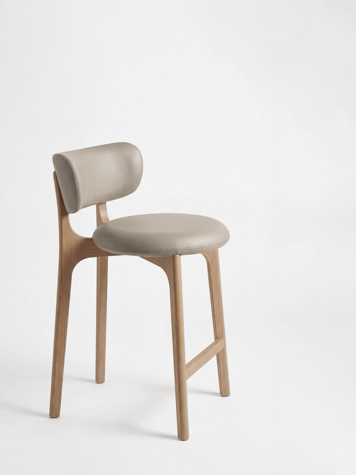 Richmond Bar Stool side view showing curved backrest and oak frame