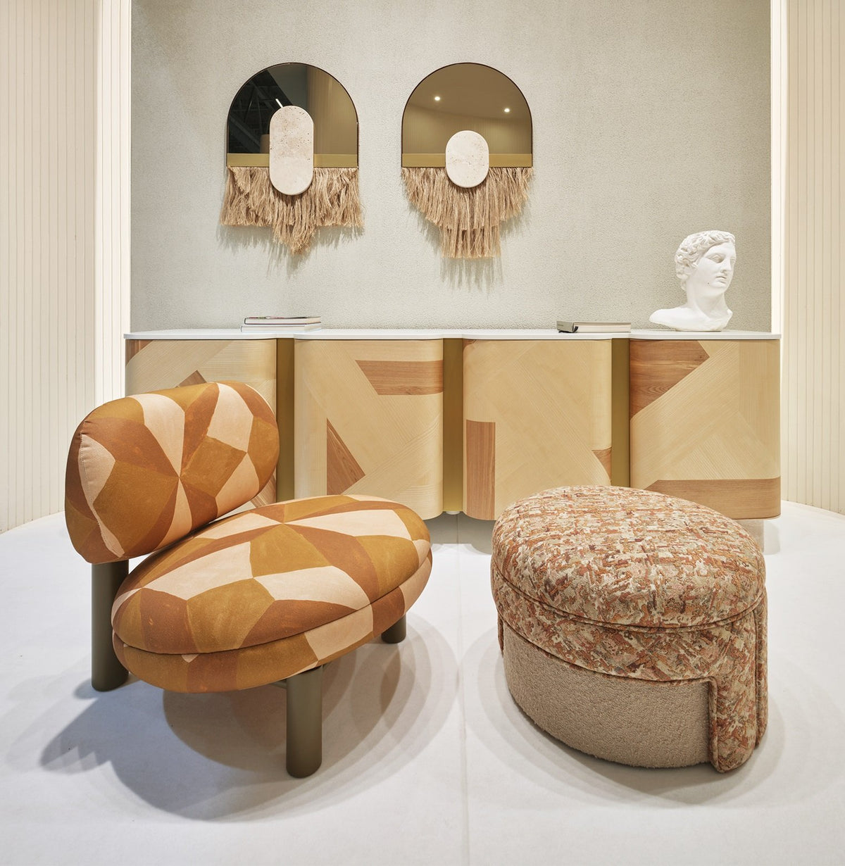 Souk Ecru Mirror Cream pair above a sideboard with patterned lounge chair and pouf