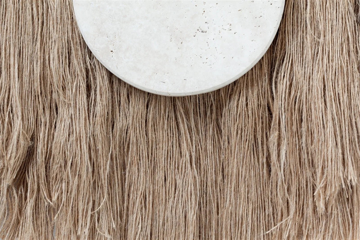 Souk Ecru Mirror Linen close-up of the travertine edge over linen fringe
