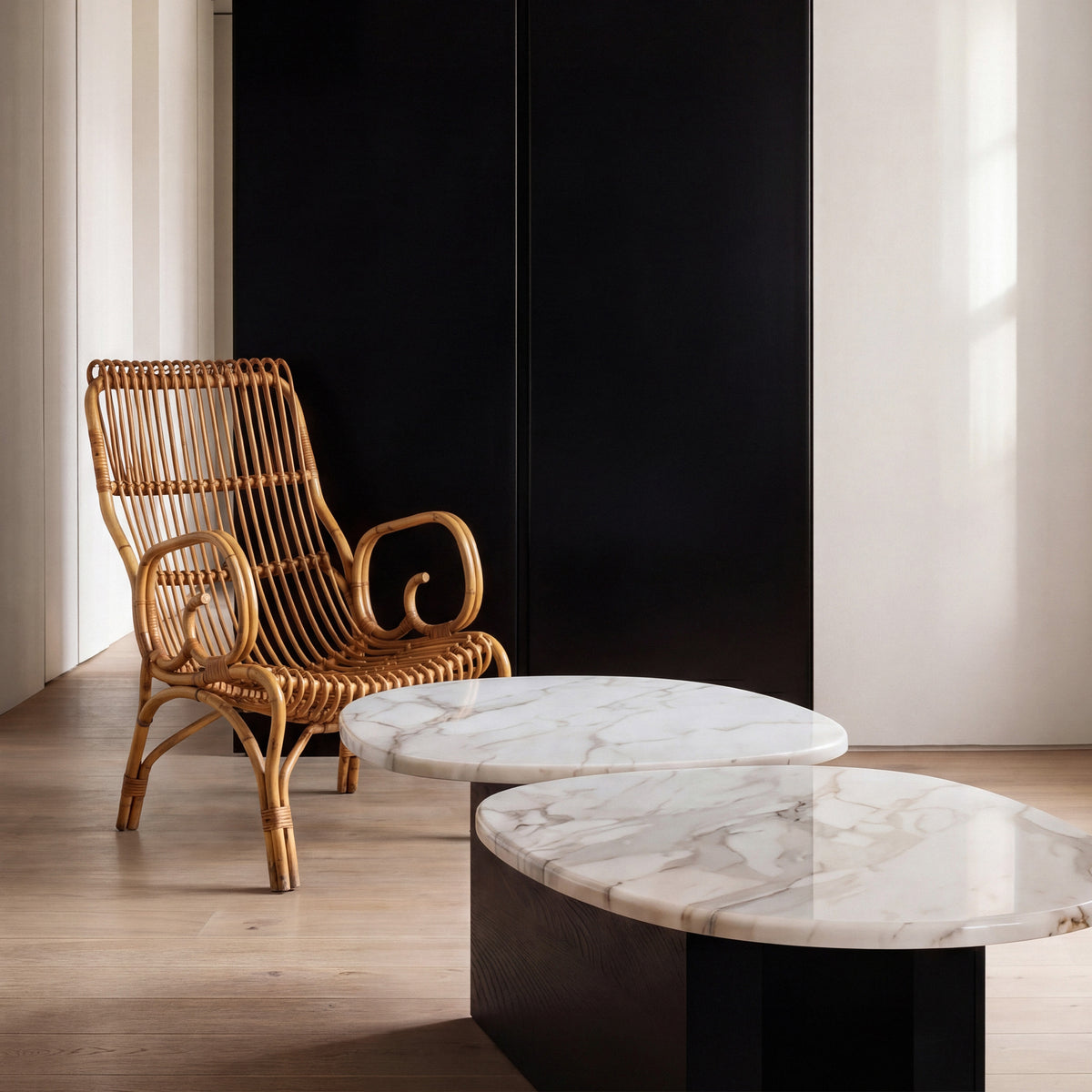 Taras Coffee Table with white marble tops and a rattan chair, close room view