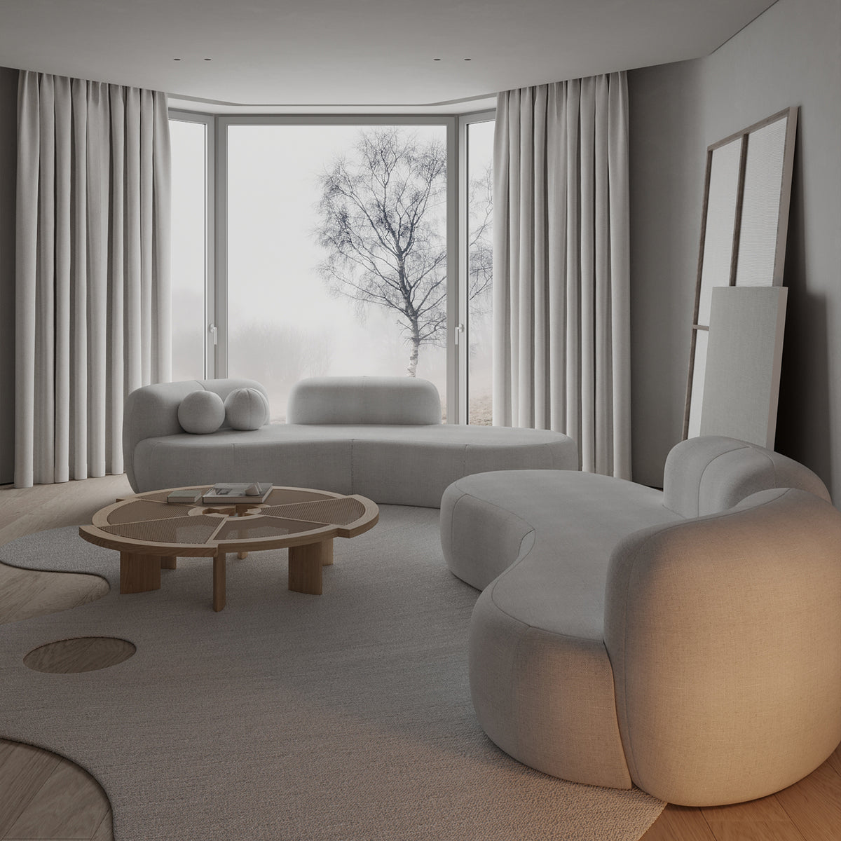 Tateyama XL Sofa in white boucle, wide view of the curved form by a bay window